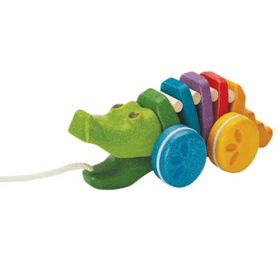 צעצוע עץ בצורת תנין עם חוליות צבעוניות בצבעי צהוב, ירוק, כחול, אדום וסגול